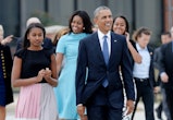 US President Barack Obama, First Lady Michelle Obama and daughters Malia and Sasha arrive to greet H...