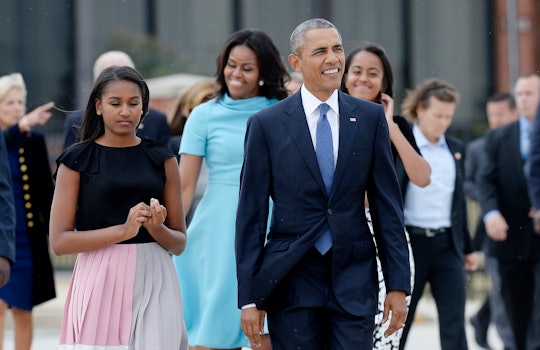 US President Barack Obama, First Lady Michelle Obama and daughters Malia and Sasha arrive to greet H...