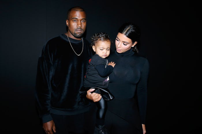 PARIS, FRANCE - SEPTEMBER 24:  Kanye West, Kim Kardashian and their daughter North West attend the B...
