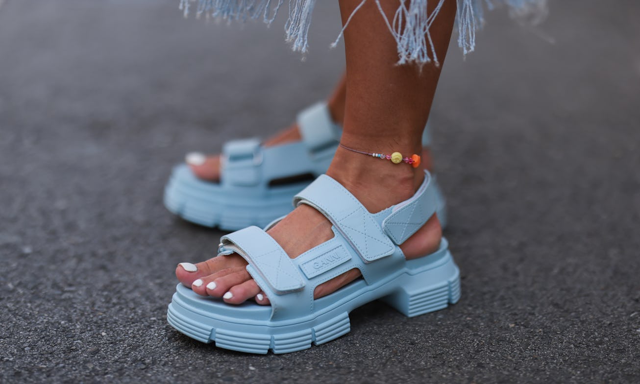 MUNICH, GERMANY - JULY 20: Karin Teigl wearing blue Ganni sandals on July 20, 2021 in Munich, German...