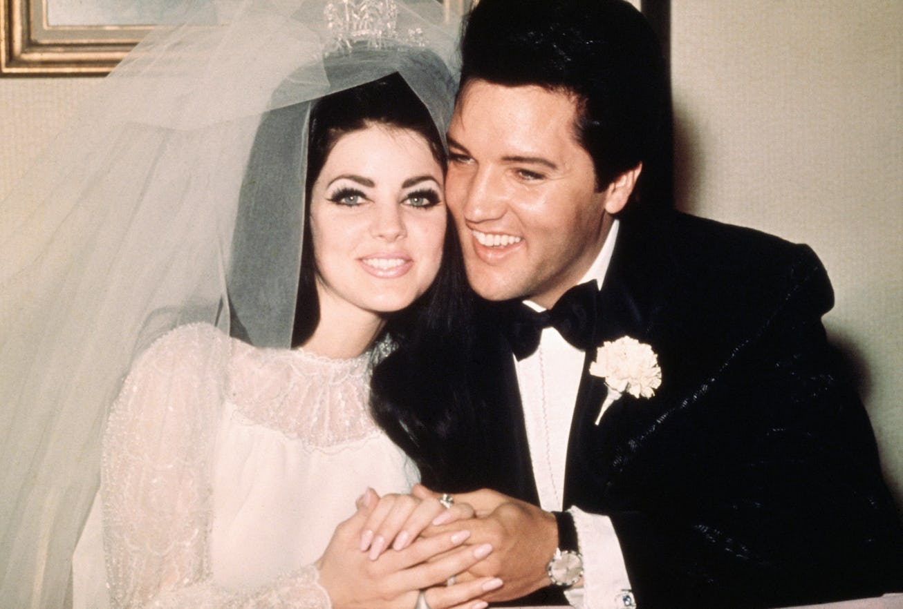 (Original Caption) Las Vegas, Nev..Entertainer, Elvis Presley sits cheek to cheek wit his bride, the...