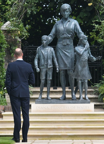 Britain's Prince William, Duke of Cambridge gestures at the unveiling of a statue of their mother, P...