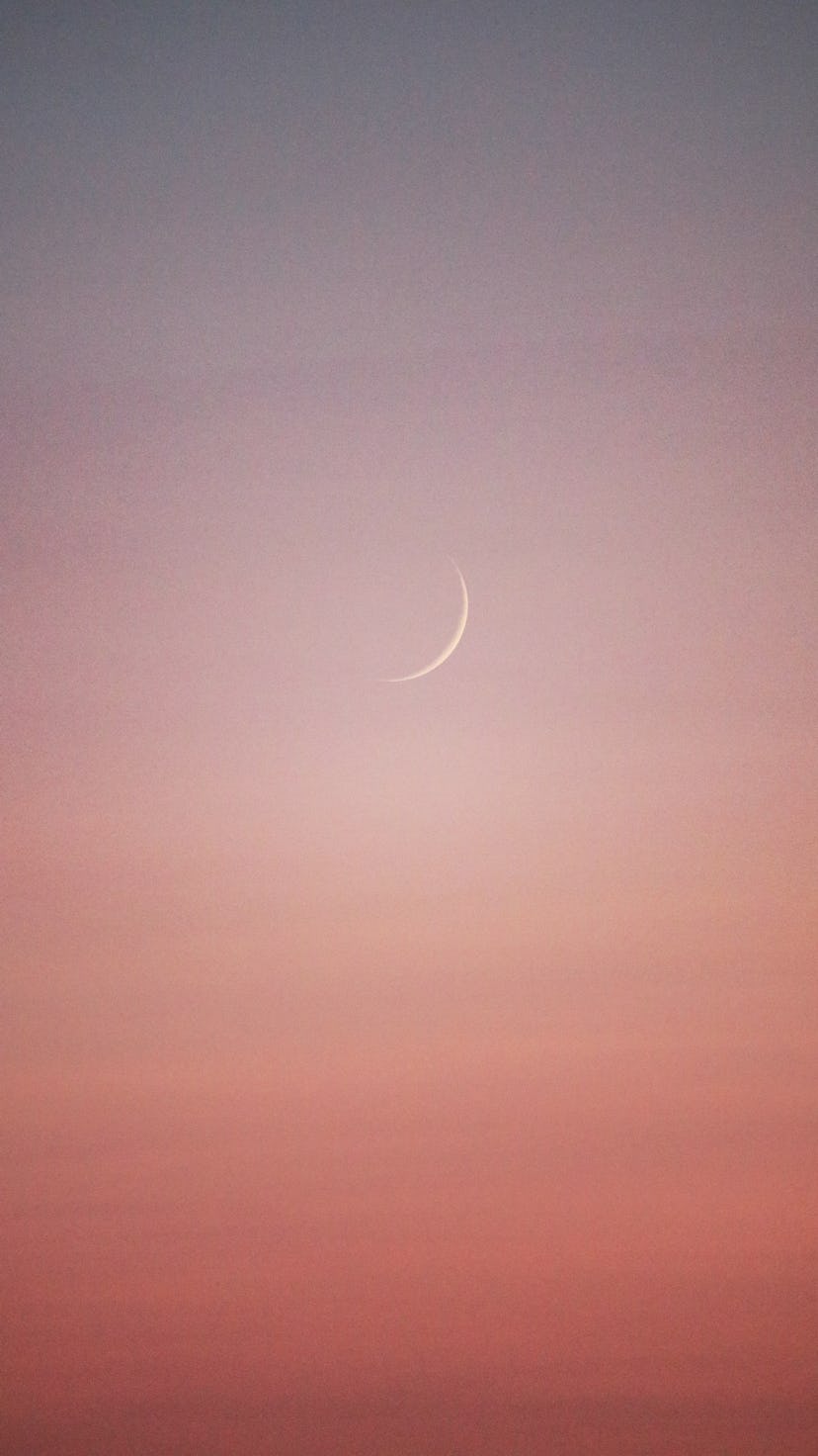 The young moon is setting during a beautiful sunrise. June 2022 new moon do's and don'ts.