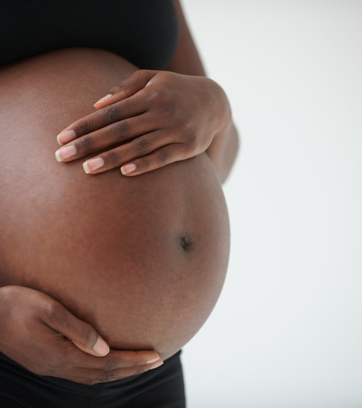 woman holding pregnant stomach, how long does it take sperm to induce labor