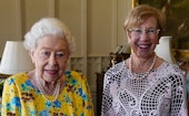 Britain's Queen Elizabeth II poses for pictures with Governor of New South Wales Margaret Beazley (R...