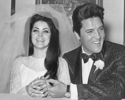1st May 1967:  Rock and roll singer and actor Elvis Presley (1935 - 1977) holding hands with his bri...