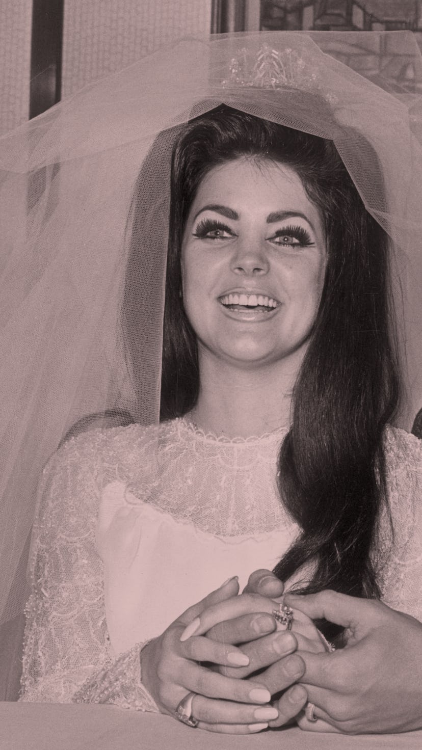 1st May 1967:  Rock and roll singer and actor Elvis Presley (1935 - 1977) holding hands with his bri...