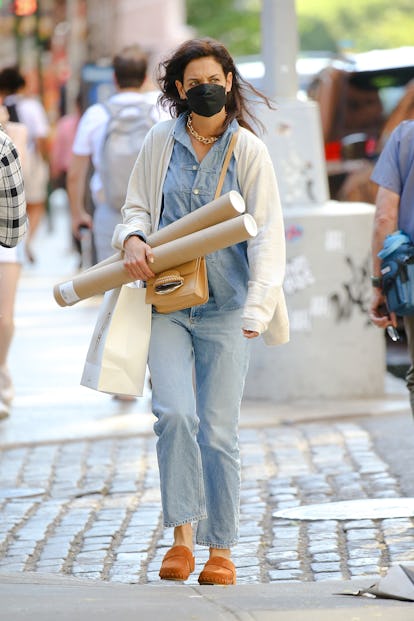 Katie Holmes wearing brown suede clogs from Chloé.