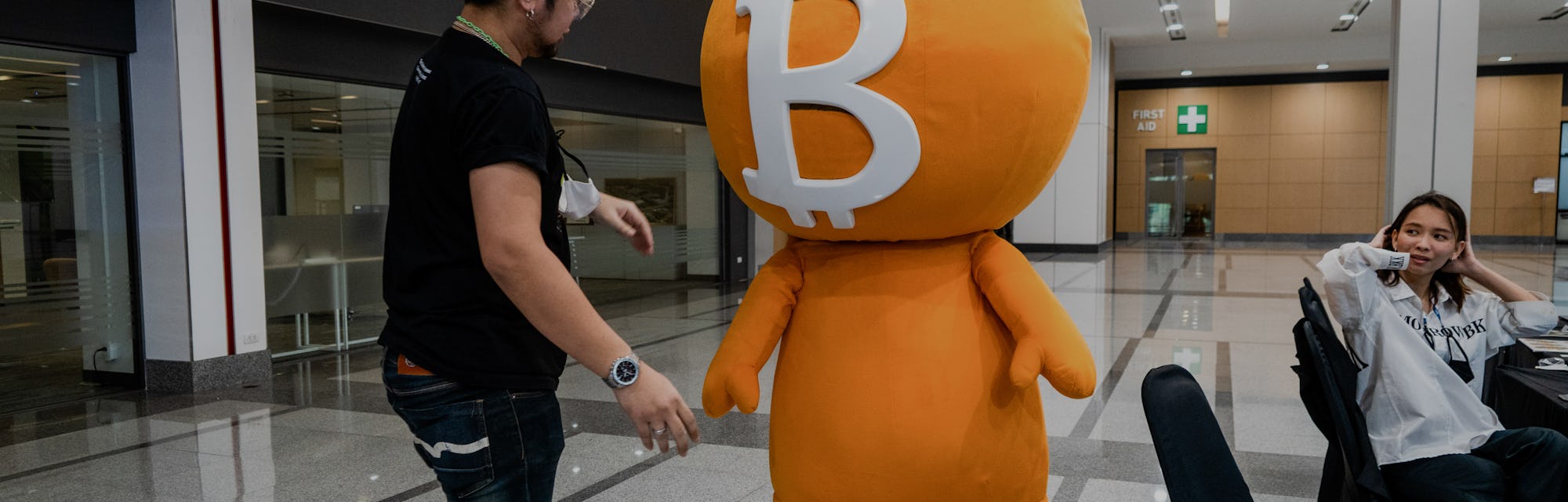 BANGKOK, THAILAND - 2022/05/13: A worker helps to put the headpiece on top of a performer in a Bitco...