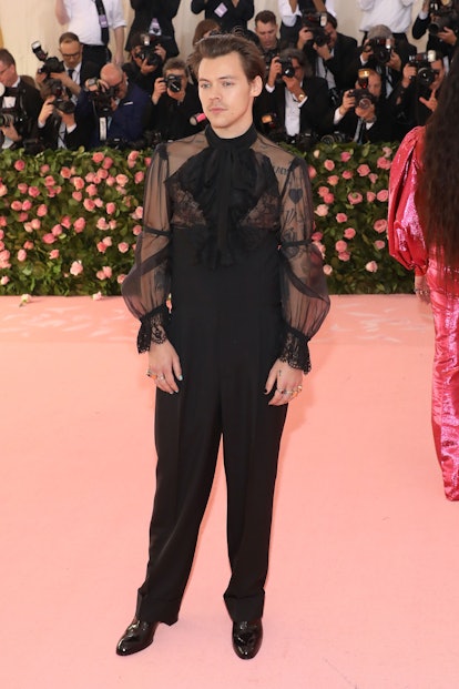 Harry Styles' aesthetic at the 2019 Met Gala is similar to the style of the 2022 Gucci HA HA HA coll...