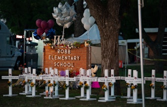 Uvalde, TX - May 26: White crosses marking the deaths are pictured in front of Robb Elementary Schoo...