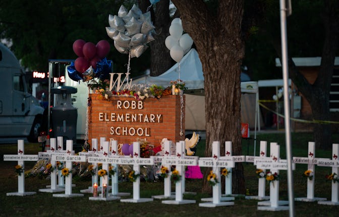Uvalde, TX - May 26: White crosses marking the deaths are pictured in front of Robb Elementary Schoo...