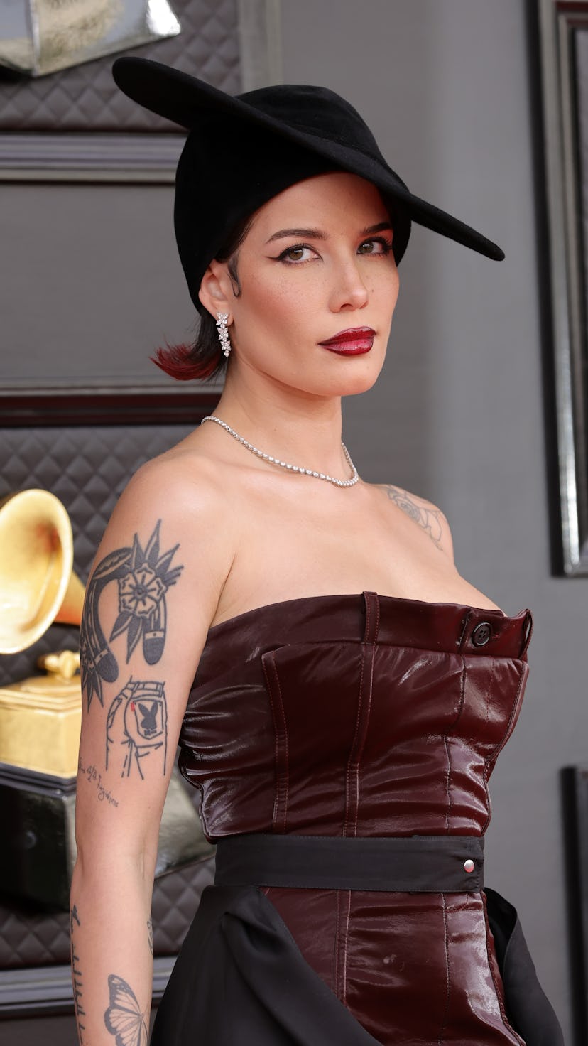 Halsey attends the 64th Annual GRAMMY Awards in a velvet dress and vintage hat