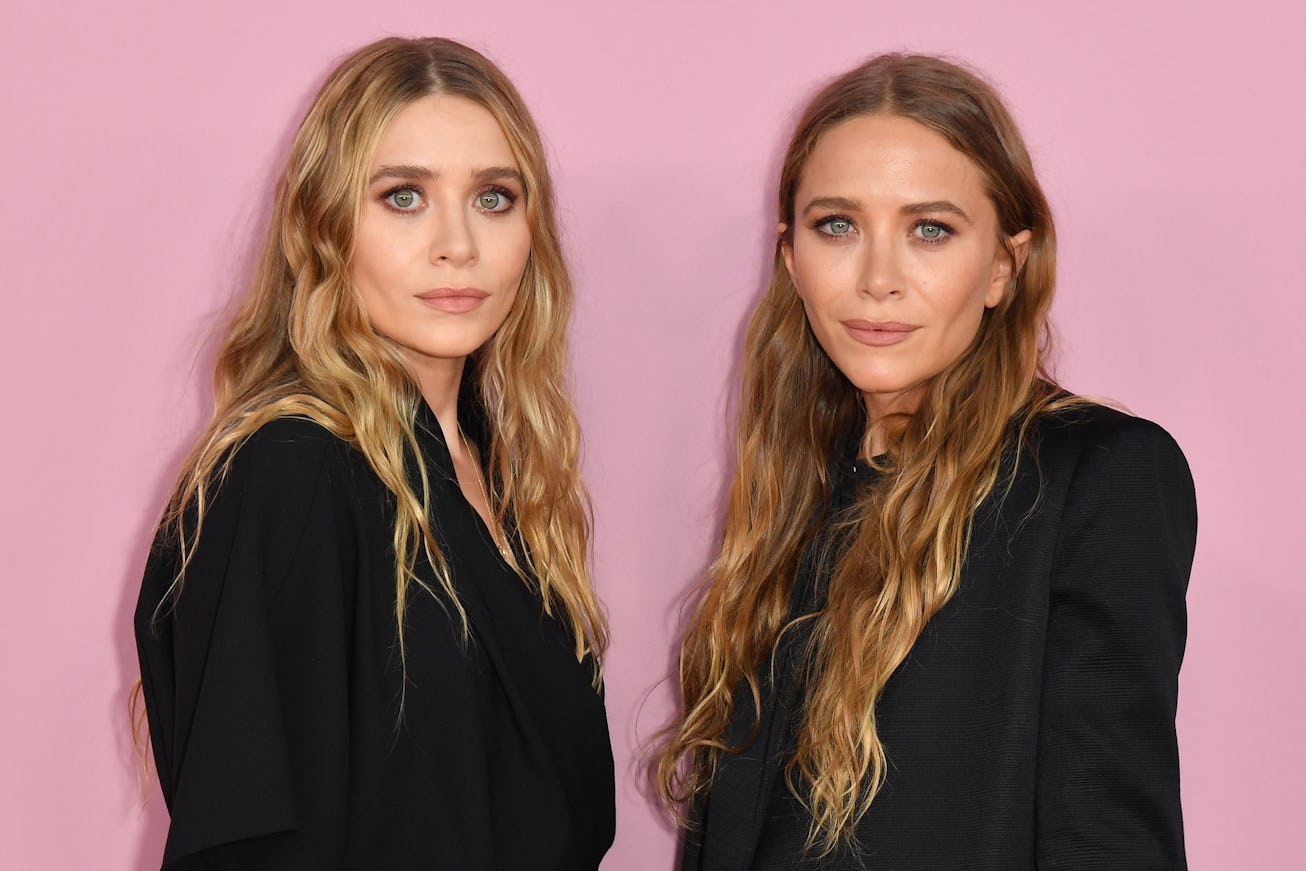 US fashion designers Mary-Kate (R) and Ashley Olsen arrive for the 2019 CFDA fashion awards at the B...