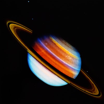 Colour photograph of the planet Saturn, taken from Voyager 1. Voyager 1 is a space probe launched by...