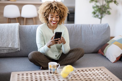 Close up of a relaxed girl using a smartphone. Here's how to change your instagram bio.