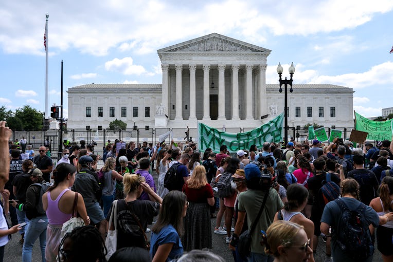 WASHINGTON, UNITED STATES - JUNE 24: Abortion rights demonstrators hold signs outside the US Supreme...