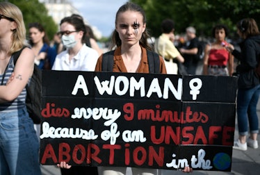 A protestor holds a sign during a rally in support of worldwide abortion rights in Paris, after the ...