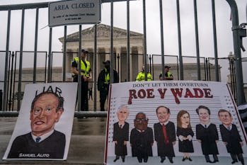 WASHINGTON, DC - JUNE 23:  Capitol Police watch an abortion-rights rally from behind the security fe...