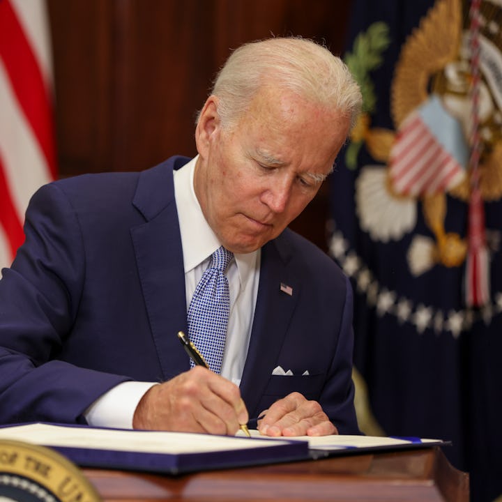 WASHINGTON, DC - JUNE 25: U.S. President Joe Biden signs the Bipartisan Safer Communities Act into l...
