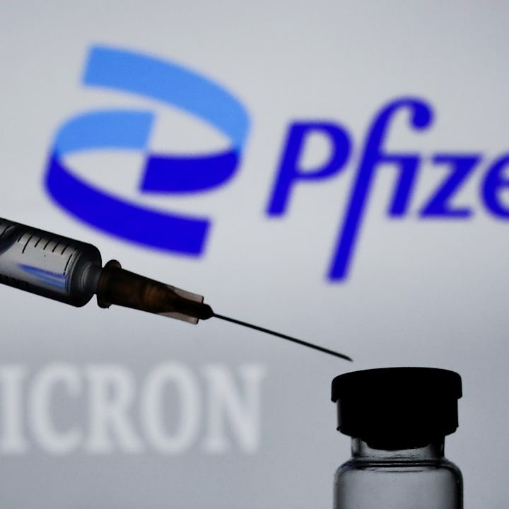 Medical syringe is seen with Pfizer logo and 'omicron' sign. Pfizer just announced that its updated ...