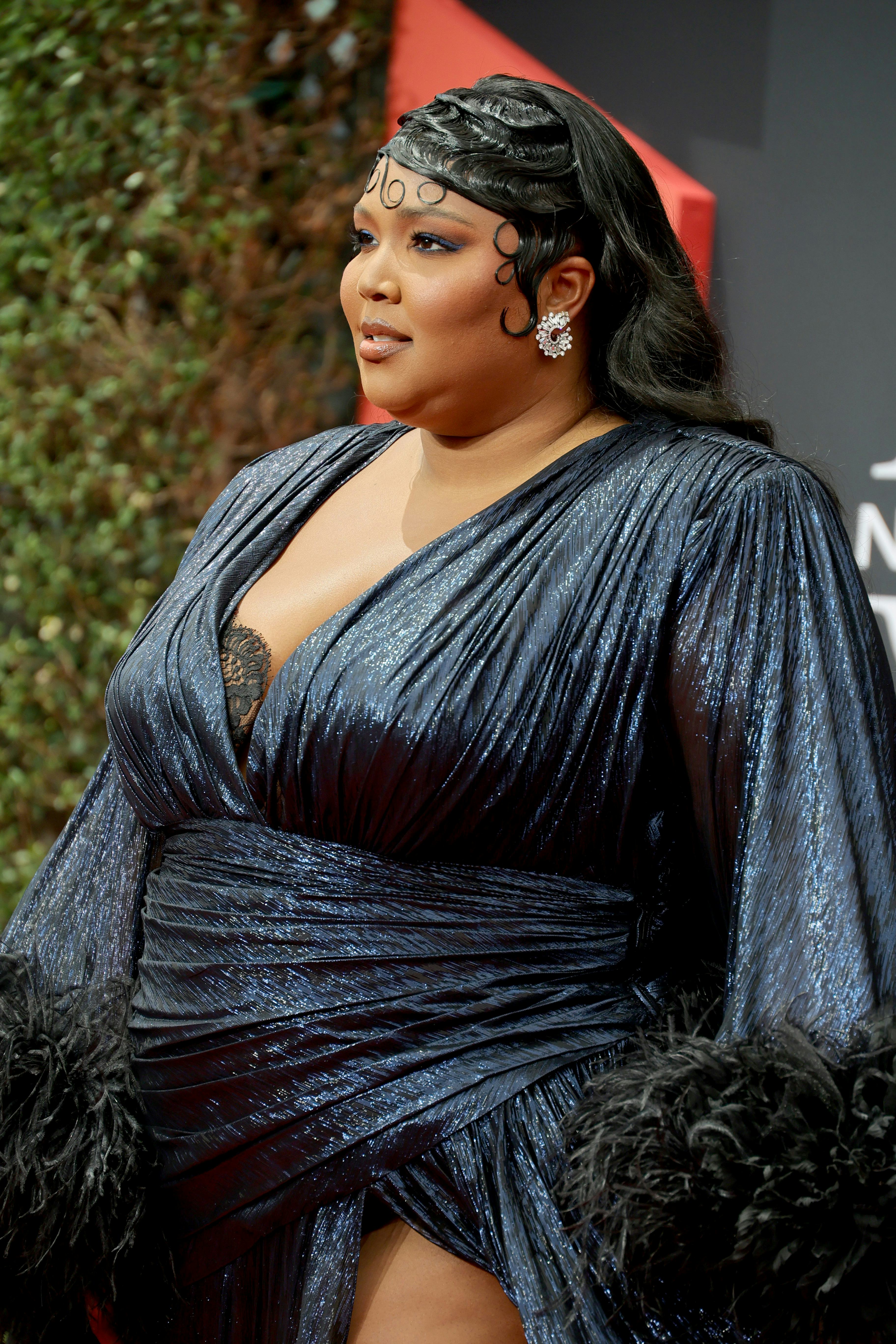 At the 2022 BET Awards, Lizzo rocked one of the best hairstyles and makeup looks on the red carpet.