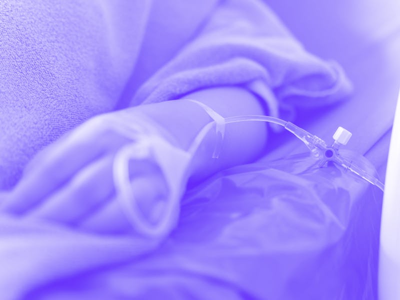 hand of the patient is on drip receiving a saline solution on bed VIP room at hospital. Medical Conc...