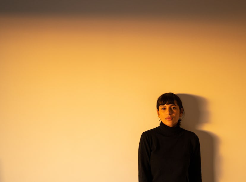 Young woman poses at golden hour as she reflects on the spiritual meaning of the June 2022 new moon ...