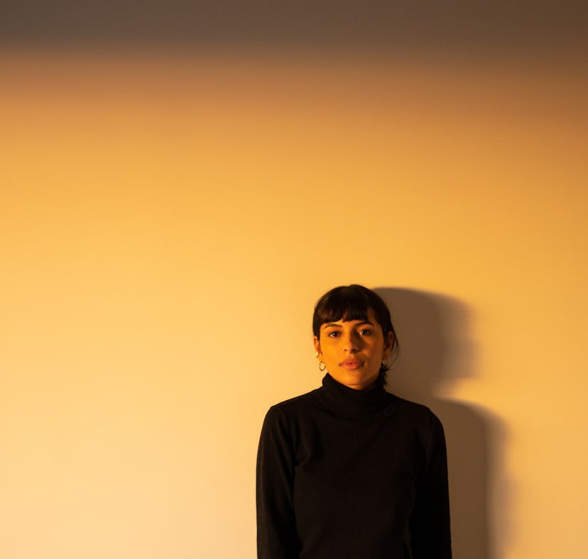 Young woman poses at golden hour as she reflects on the spiritual meaning of the June 2022 new moon ...