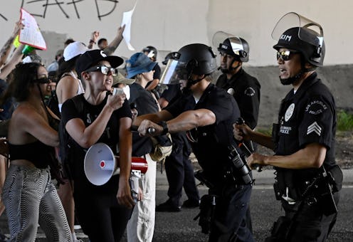 Los Angeles, CA - June 25:  LAPD officers clash with activists including Full House actress Jodie Sw...