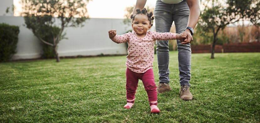 Shot of an adorable baby girl having fun with her dad in their backyard, earthy girl names