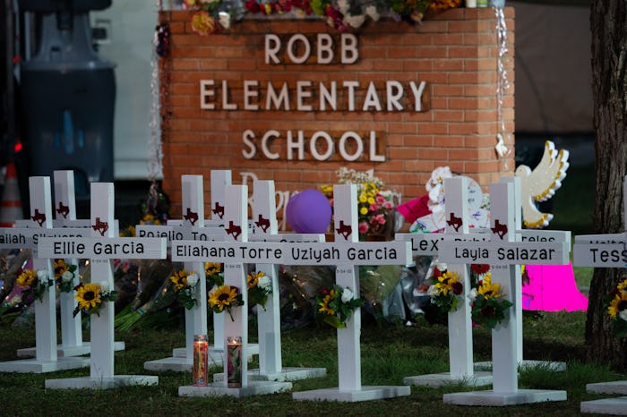 White crosses marking the deaths are pictured in front of Robb Elementary School in Uvalde, Texas e...