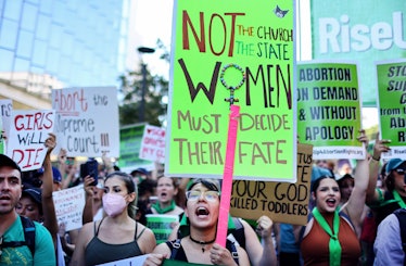 LOS ANGELES, CALIFORNIA - JUNE 27:  Abortion rights supporters march while protesting against the re...