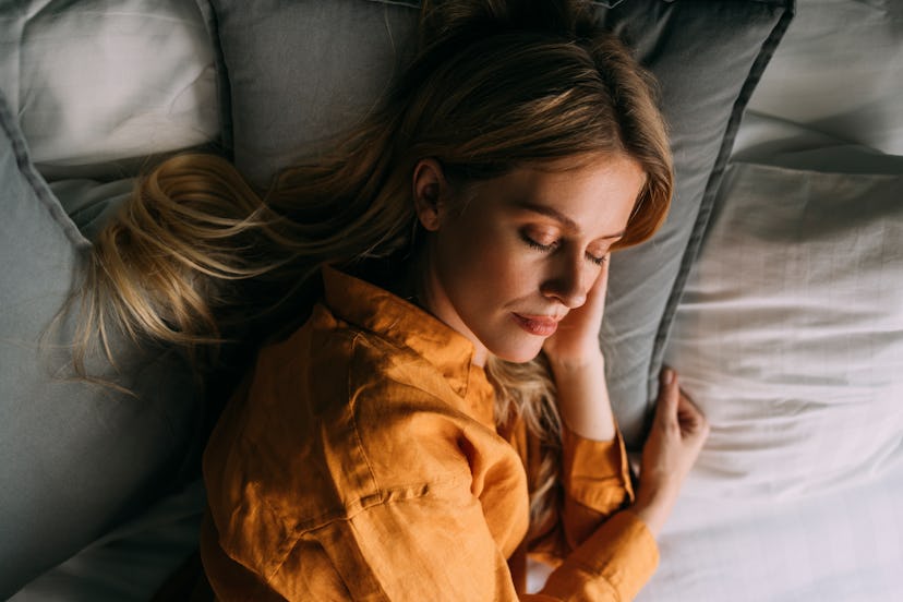 A charming Caucasian woman resting at home after a  long day.