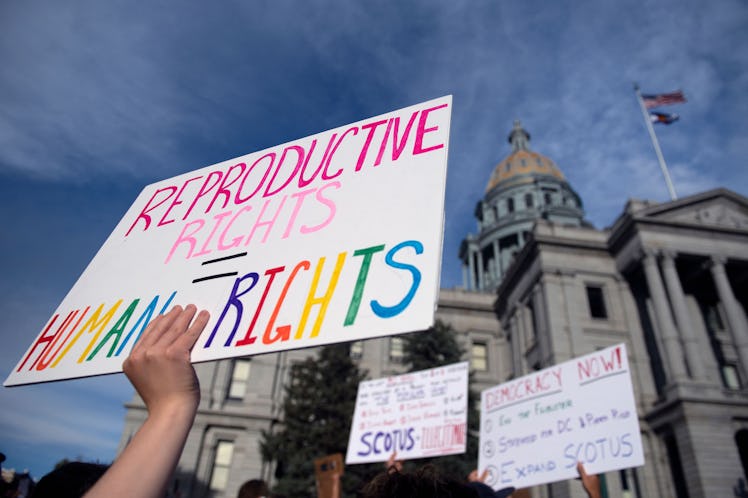 Abortion rights activists protest in front of the Colorado State Capitol in Denver, Colorado on June...