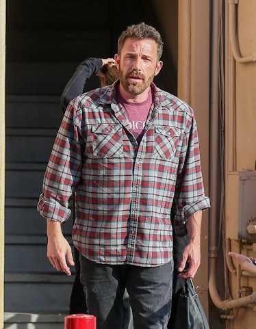 Ben Affleck in a plaid shirt and jeans.