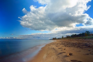 Along the southern shore of Lake Superior in northern Wisconsin huge billowing clouds roll overhead....