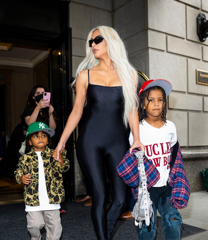 NEW YORK, NEW YORK - JUNE 21: (L-R) Psalm West, Kim Kardashian and Saint West are seen in Midtown on...