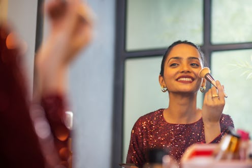 woman applying makeup