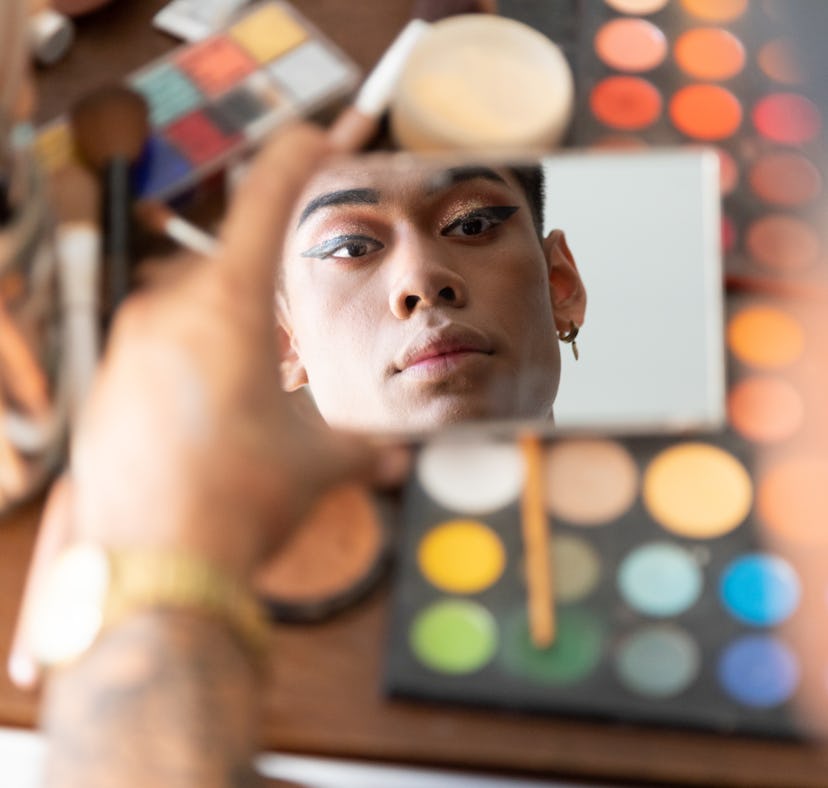 a man uses makeup hacks to make his makeup routine so much easier.