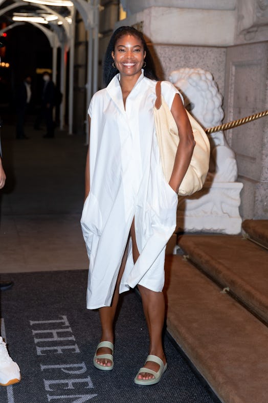 gabrielle union wearing a white shirtdress with sandals 