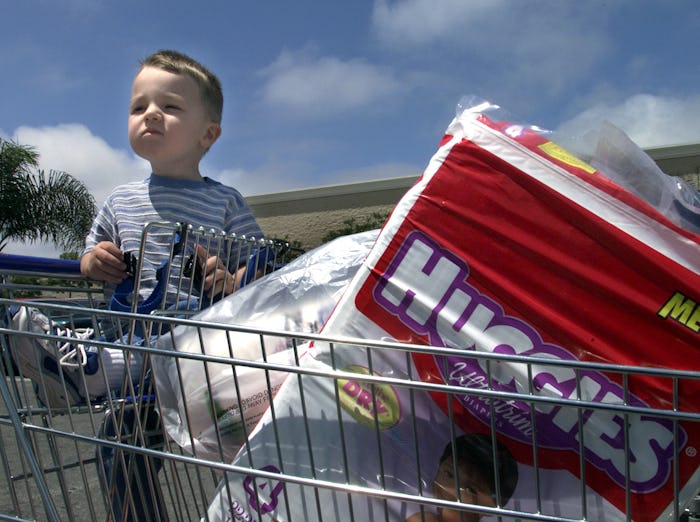 Michael Huffman,1, waits as mom looked for car keys to put away items bought at Walmart in Oxnard. A...