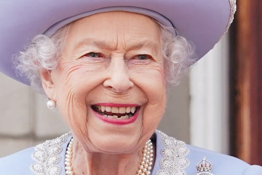 Britain's Queen Elizabeth II stands on the Balcony of Buckingham Palace as the troops march past dur...