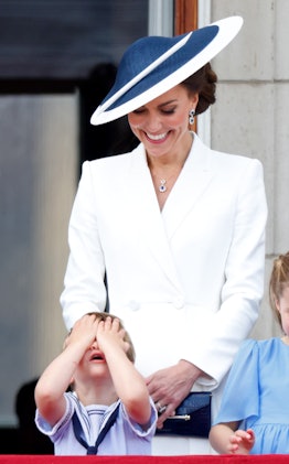 Prince Louis of Cambridge and Catherine, Duchess of Cambridge watch a flypast from the balcony of Bu...