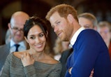 TOPSHOT - Britain's Prince Harry and his fiancée US actress Meghan Markle watch a dance performance ...