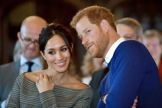 TOPSHOT - Britain's Prince Harry and his fiancée US actress Meghan Markle watch a dance performance ...