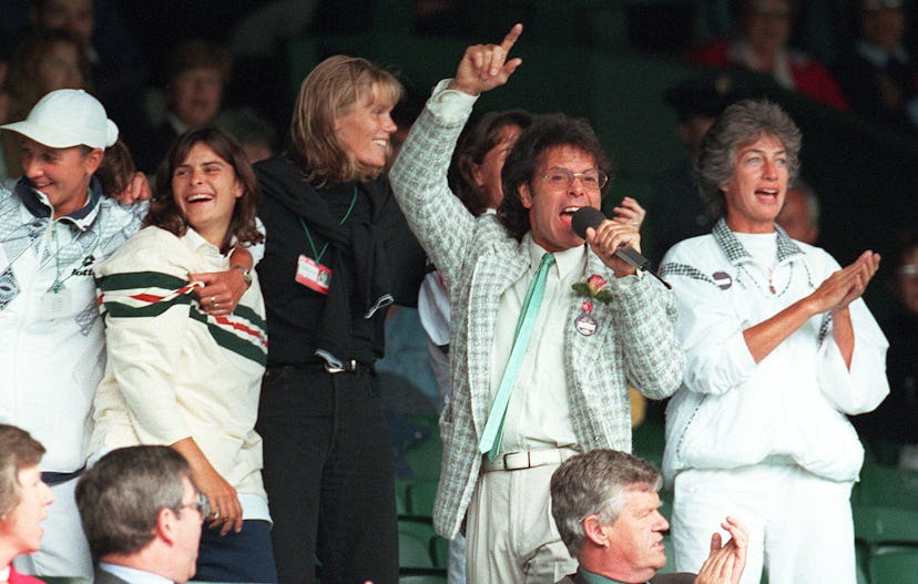 Sir Cliff Richard leads the community singing on Centre Court at Wimbledon this afternoon (Wednesday...