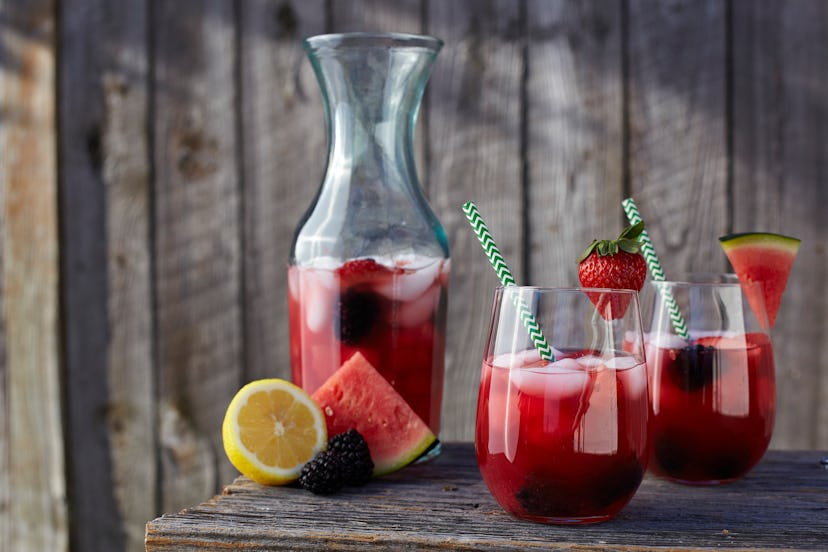 Strawberry watermelon lemonade outside with fence.