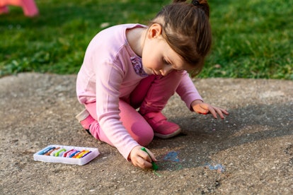 playing with chalk is an educational summer activity for kids