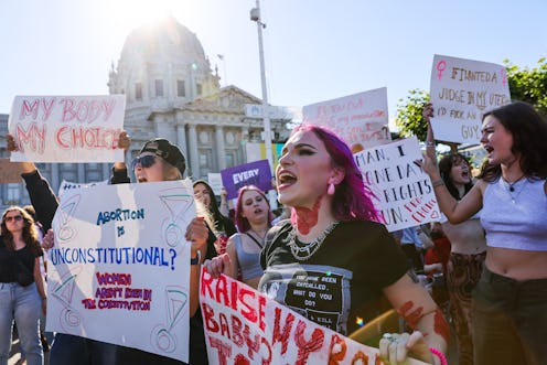 SAN FRANCISCO, CA - JUNE 24: Zuzu Gehrman-McCord (center) protests after the Supreme Court overturne...